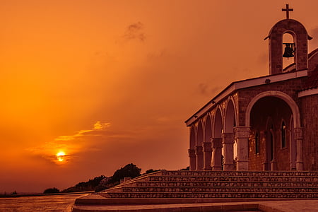 brown concrete church under sunset thumbnail