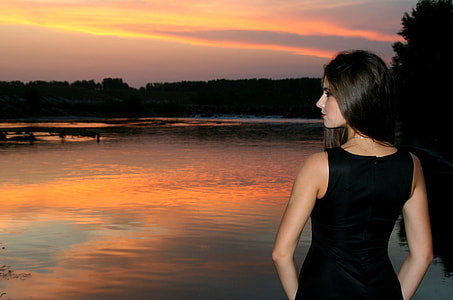 woman wearing a black sleveless dress thumbnail