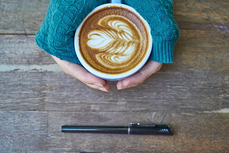 person holding white ceramic mug thumbnail