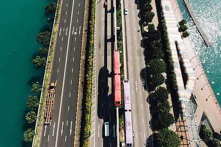 aerial photo of road near body of water thumbnail
