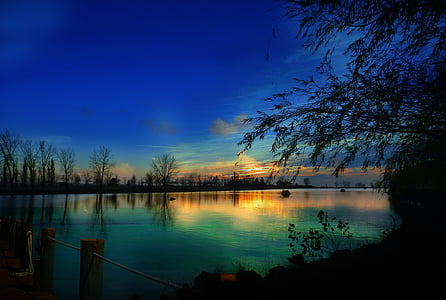 body of water during sun rise thumbnail