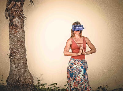 Woman Standing Wearing Brown Tank Top thumbnail