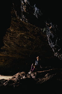 woman sitting inside cave thumbnail