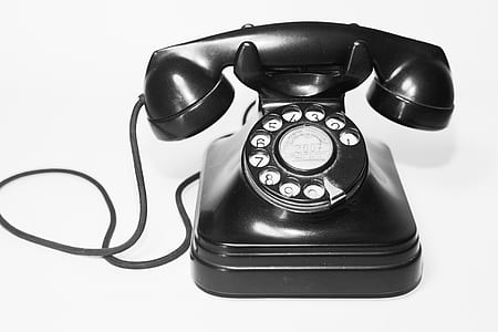 black rotary telephone on table thumbnail