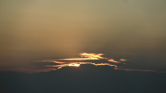 sun setting on clouds thumbnail