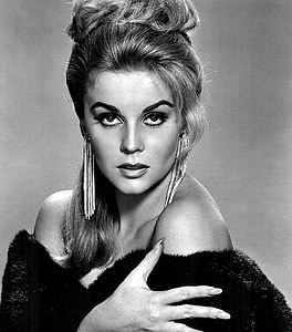 grayscale photo of woman wearing black fur top thumbnail