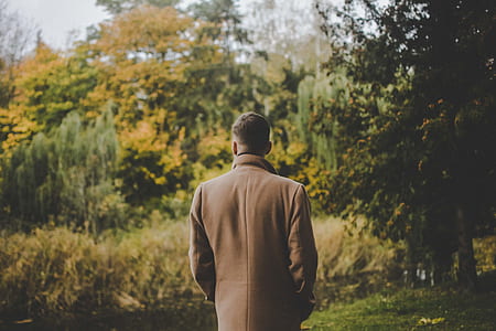 man standing in front of trees thumbnail
