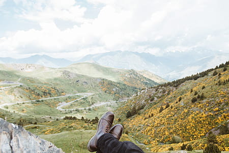man sitting on cliff thumbnail