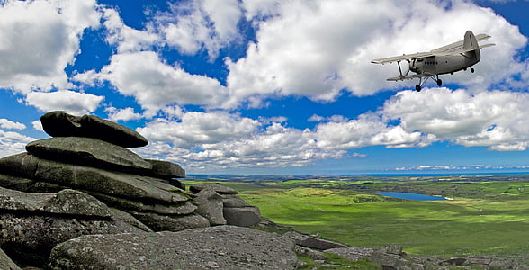 gray biplane in midair thumbnail