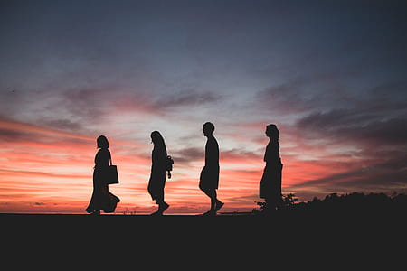silhouette photography of four persons thumbnail