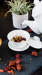 white ceramic teacup on white saucer thumbnail