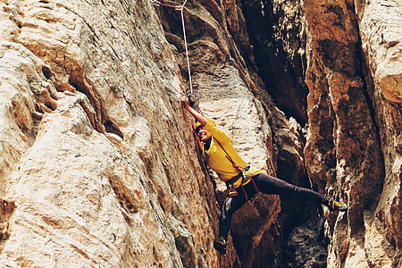 man climbing on cliff thumbnail