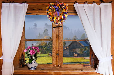 pink petaled flower on vase and floral wreath hanged on curtain rod thumbnail