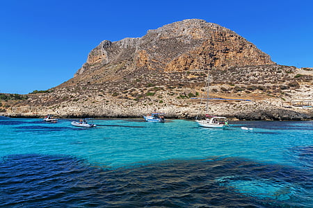 landscape photo of mountain near sea thumbnail