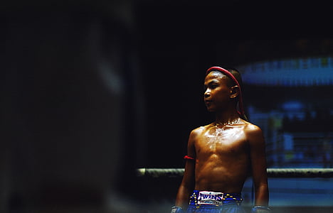 boy wearing blue sport shorts standing on ring thumbnail