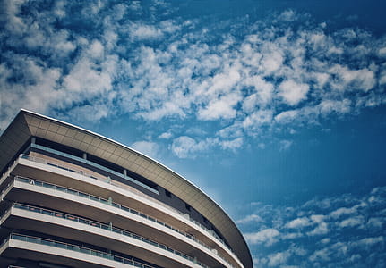 White Building Under Cloudy Day Sky thumbnail