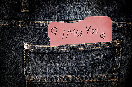 card with i miss you print on denim pocket thumbnail
