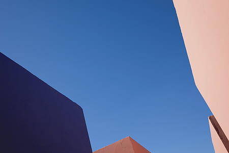 low-angle photo of brown building during daytime thumbnail