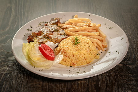 cooked rice with potato fries on white ceramic plate thumbnail