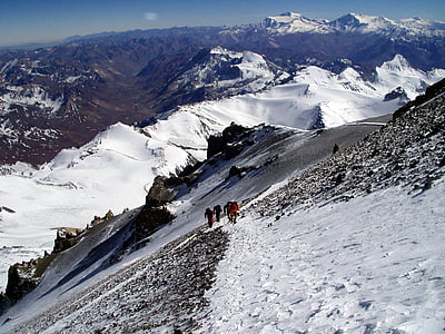 people climbing up snow covered mountain thumbnail