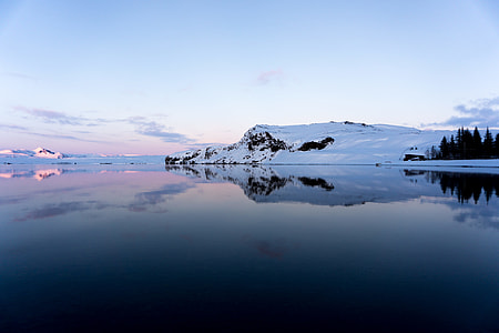 landscape photo of body of water with mountain covered with snow thumbnail