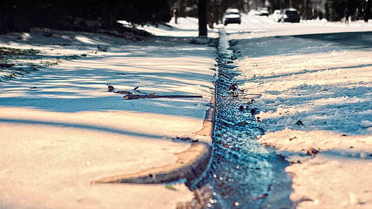 flowing water on gray concrete curb at daytime thumbnail