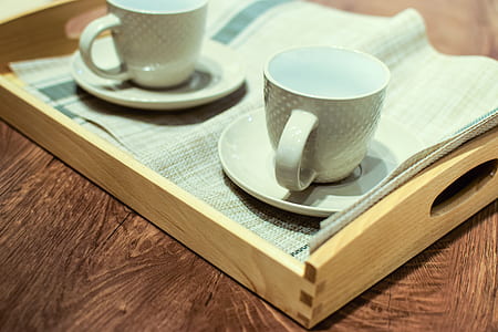 two white ceramic teacups in platers thumbnail