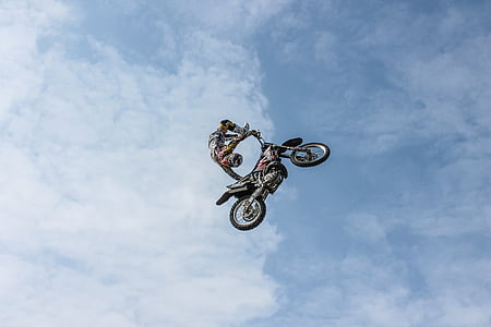 man riding motocross dirt bike thumbnail
