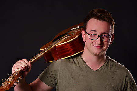 man holding guitar thumbnail