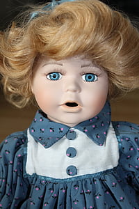 female doll wearing white and blue collared top thumbnail