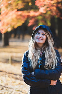 selective focus photography of woman in bubble jacket thumbnail