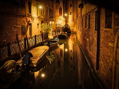 boats on body of water between building thumbnail