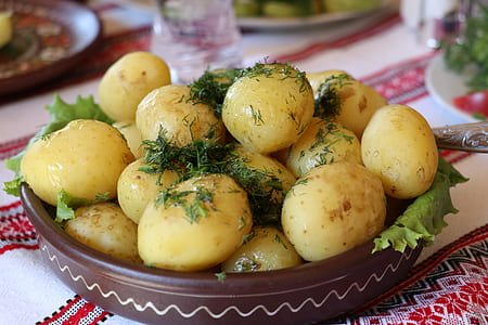 baked potatoes with rosemary on bowl thumbnail