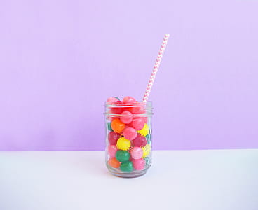 assorted-color balls in clear glass jar thumbnail