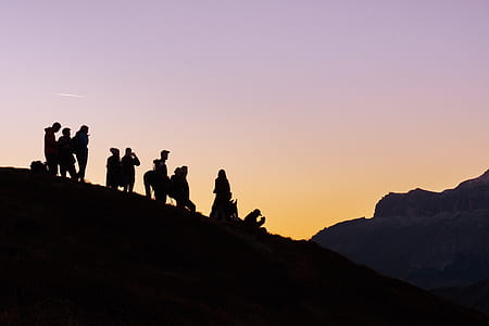 silhouette photo of group of people on mountain top thumbnail