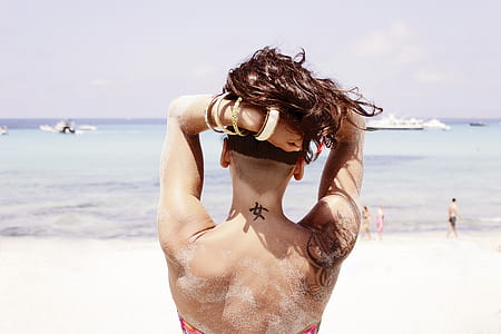 woman with tattoo at neck thumbnail
