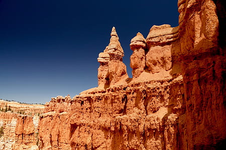 mountain range under blue sky during daytime thumbnail