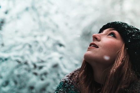 selective focus photography of woman looking with snows thumbnail