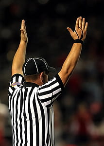 man standing while raising his hands thumbnail