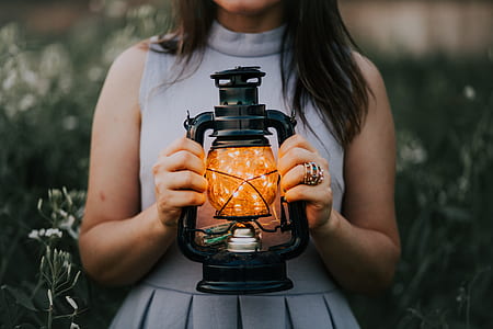 women's holding lantern lamp thumbnail