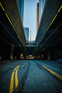 concrete road between buildings thumbnail