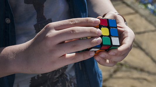 person holding Rubik's cube thumbnail