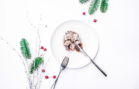 pastry in round white ceramic plate beside fork thumbnail