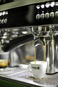 White Ceramic Di Bella Espresso Cup on Black and Gray Espresso Machine thumbnail
