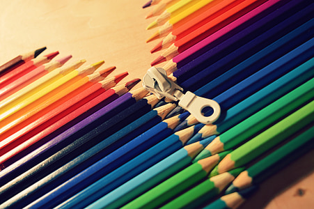 white zipper in between assorted-color pencils thumbnail