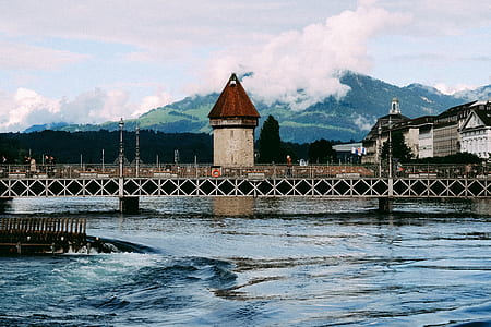 photography of bridge and tower during daytime thumbnail