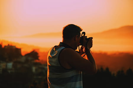 man photographing during golden hour thumbnail
