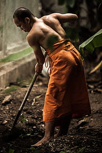 man shoveling soil thumbnail