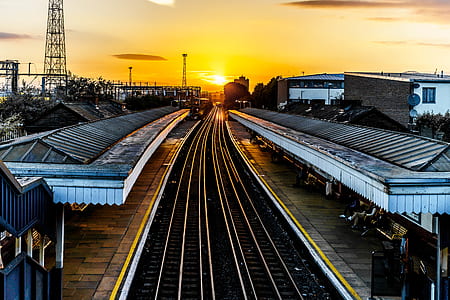 gray railroad during sunset thumbnail