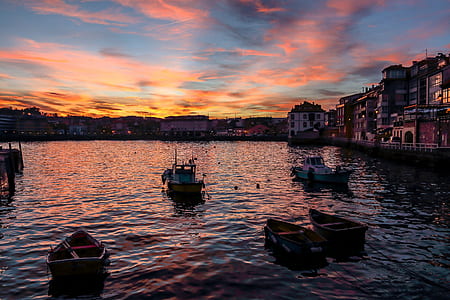 boats on body of water at golden hour thumbnail
